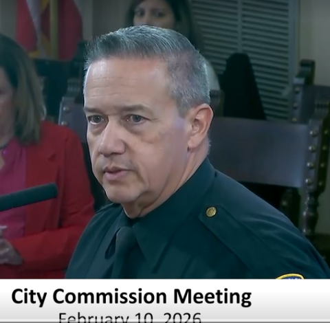 Tomas Salcedo at the podium in police uniform